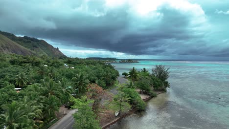 Scenic-Coastal-Road-With-Palm-Tees-In-North-Coast-Of-Moorea-In-French-Polynesia