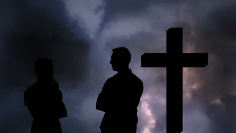 animation of silhouette of couple over clouds and cross