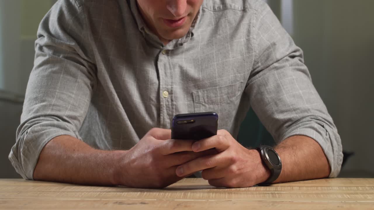 Caucasian man using his phone