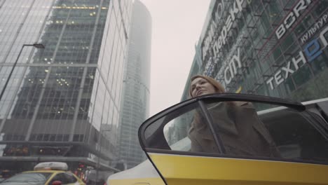 woman in a taxi in a modern city