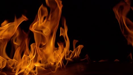 Flames-of-fire-on-black-background-in-slow-motion