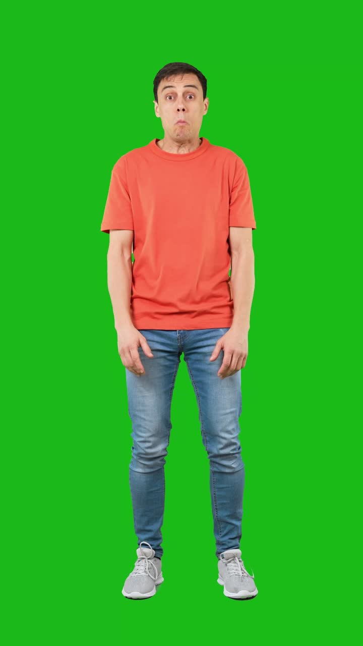 Man with a disgusted grimace on a green screen
