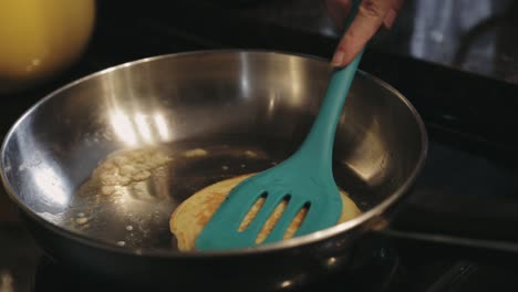 Turning-The-Other-Side-Of-The-Pancake-And-Cooking-Until-It-Is-Browned---Close-up-Shot