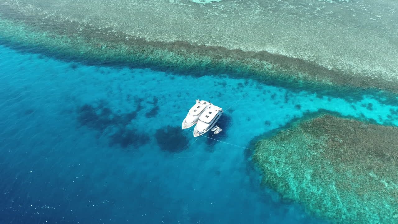 Aerial View of Boats Moored in a Tropical Coral Reef Lagoon