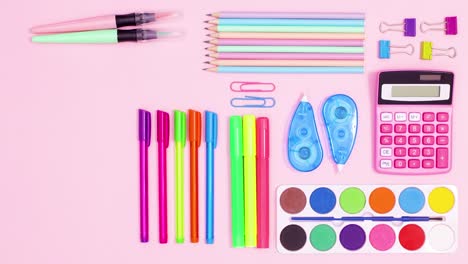 pastel school accessories appear and make creative layout on pastel pink theme. stop motion