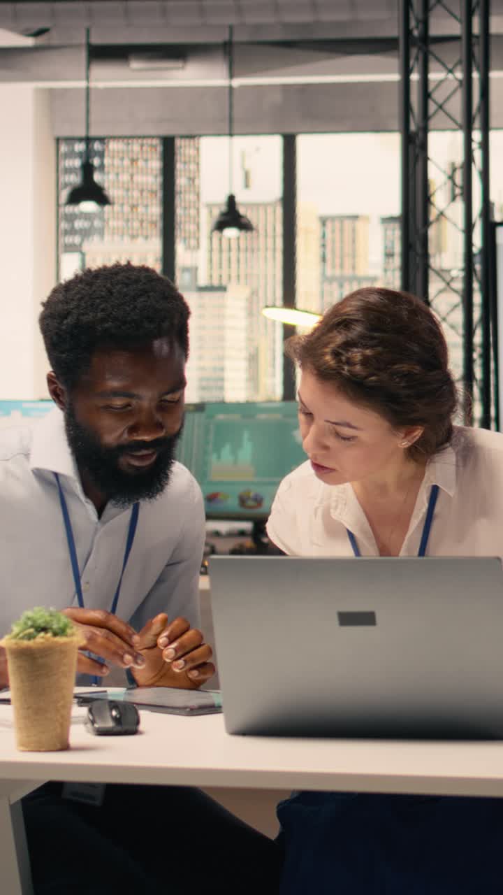 Vertical Video Diverse business team holding strategy briefing in modern office