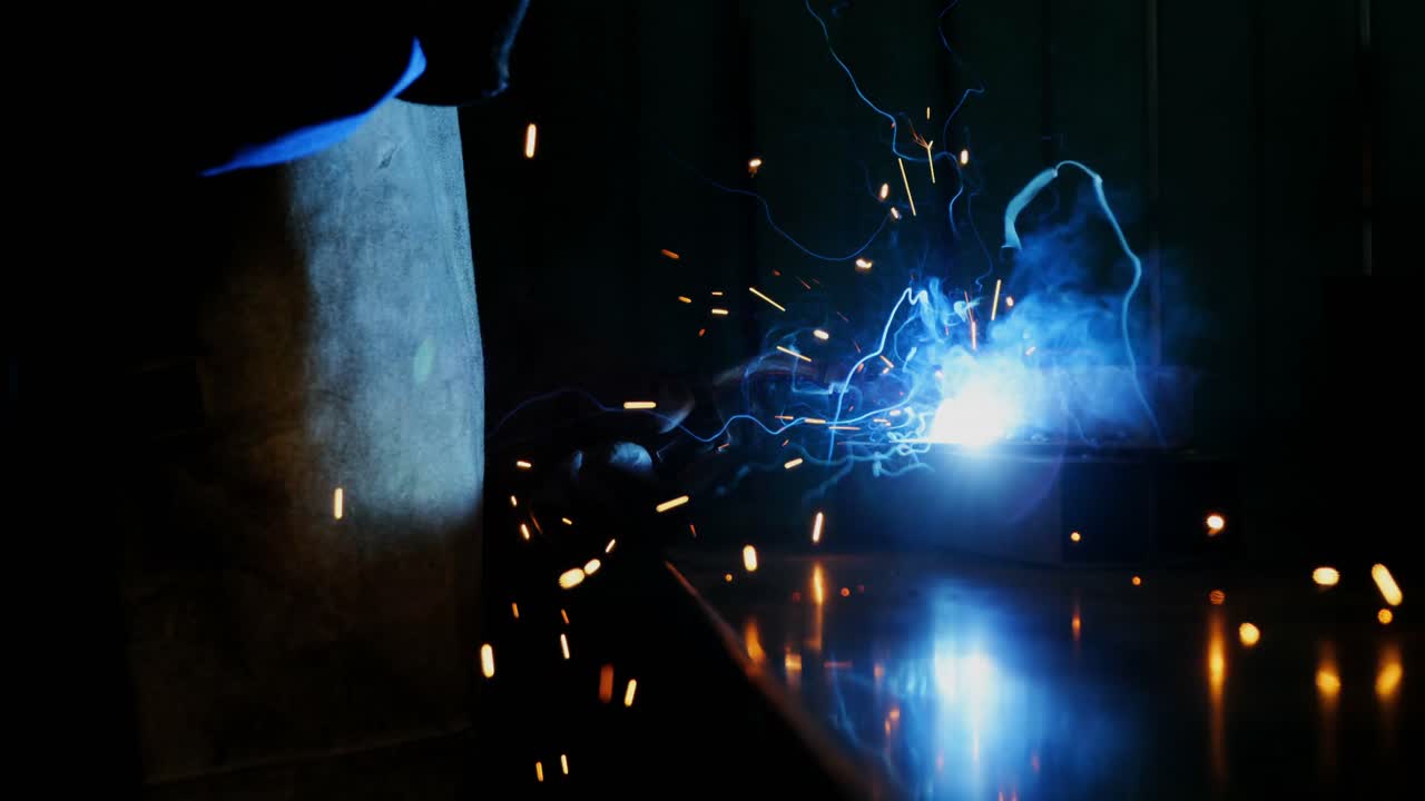 Welder welding a metal
