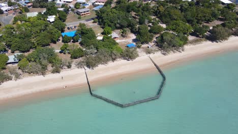 Aerial-View-Of-Dingo-Beach-With-Swimming-Enclosure---Dingo-Beach-Foreshore-Reserve-Park-In-Whitsunday,-QLD,-Australia