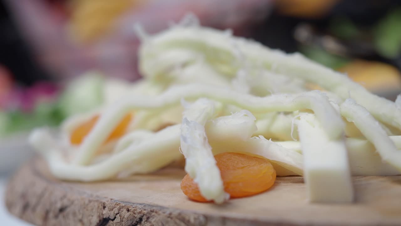 Sliced White Cheese with Dried Apricots
