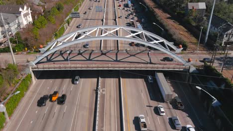 Aerial-of-cars-on-59-South-freeway-in-Houston,-Texas-on-a-bright-sunny-day