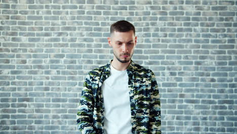 Man Wearing Party Hat and Camouflage Shirt