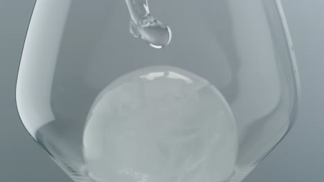 Clear-Liquid-Pouring-into-Glass-with-Ice-Cubes
