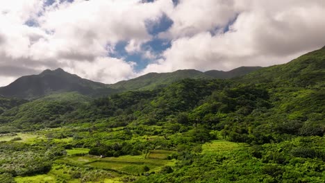 aerial flyover idyllic exotic mountain landscape with moving clouds at sky on orchid island 蘭嶼 in taiwan