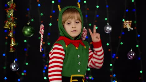 cute little girl dressed as an elf for christmas