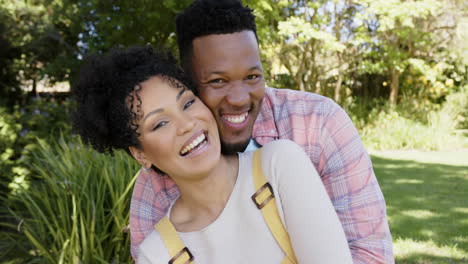 Portrait-of-happy-african-american-couple-embracing-in-garden-at-home,-slow-motion