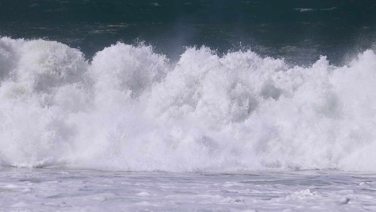 Waves crash with force and energy on shore