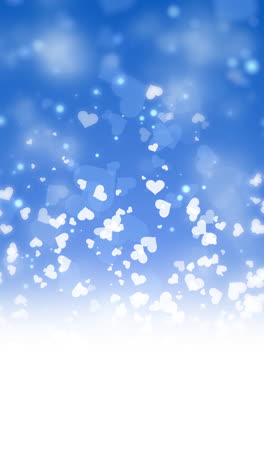 pattern of white clouds in the shape of heart on blue sky background. cartoon cloudy pattern. loop animation with copy space. vertical video.