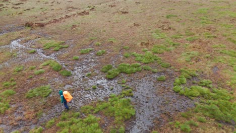 Aerial-view-of-a-backpacker-carefully-walking-to-Axe-Edge-from-Five-Stones-in-England