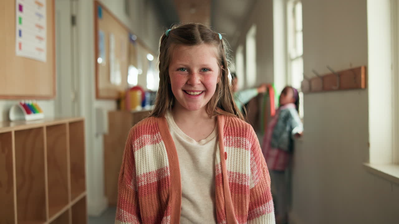 Young Girl Smiling in School Hallway