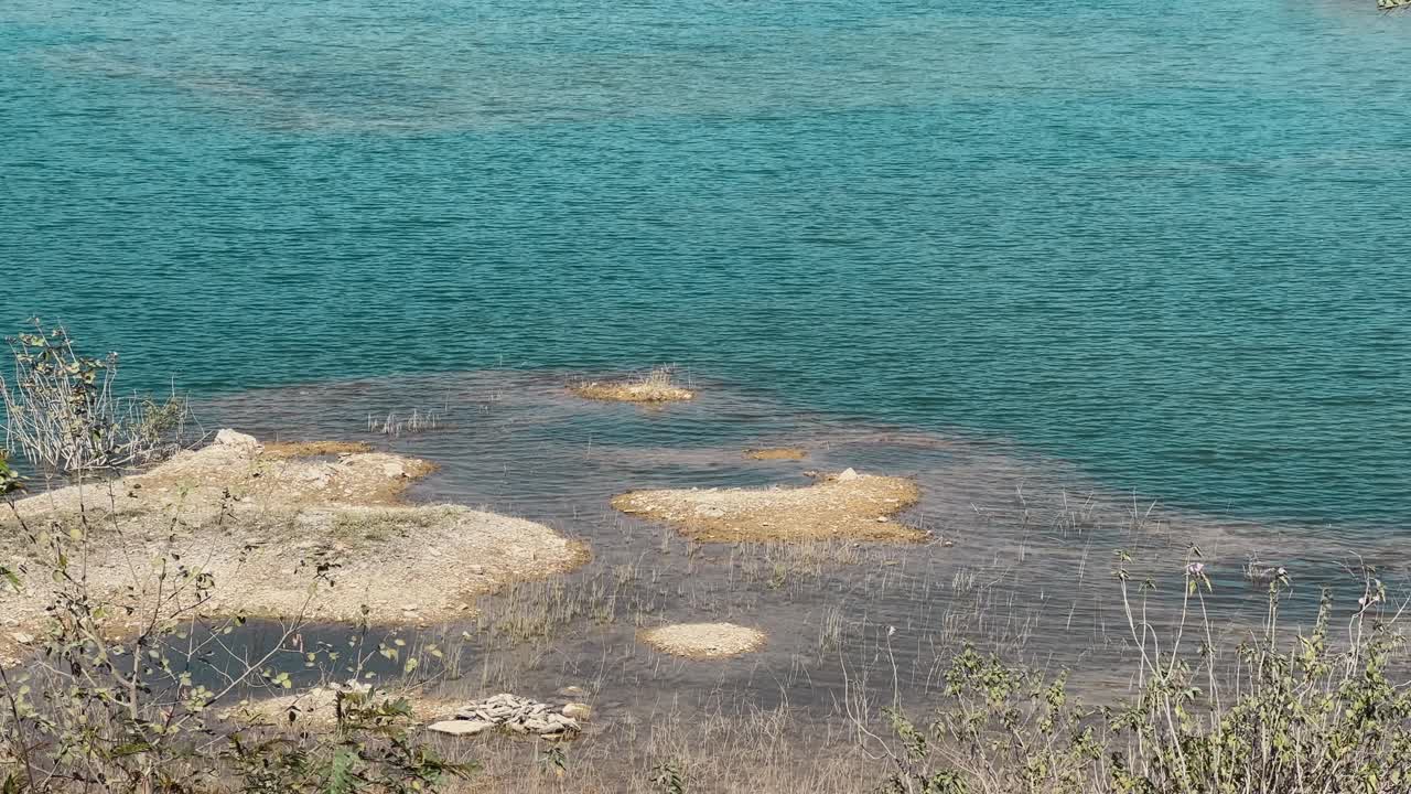 A blue colored water pond with cristle clean water