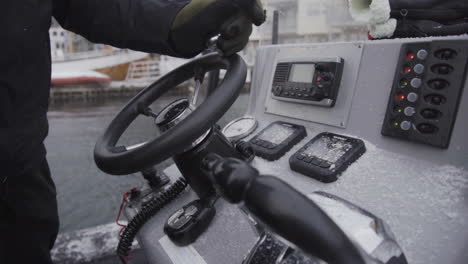 turning a steering wheel of a motorboat harbour in slow motion