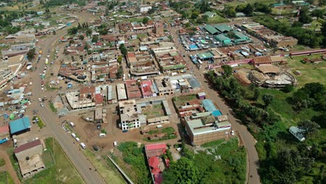 aerial drone view overlooking the open air market in a village, in sunny kenya