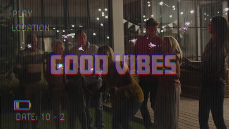 animation of good vibes text on video camera screen with digital interface, friends and sparklers