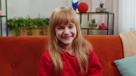 child girl laughing out loud after hearing ridiculous anecdote funny joke feeling carefree amused