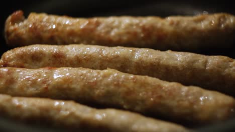 fried sausages in a pan