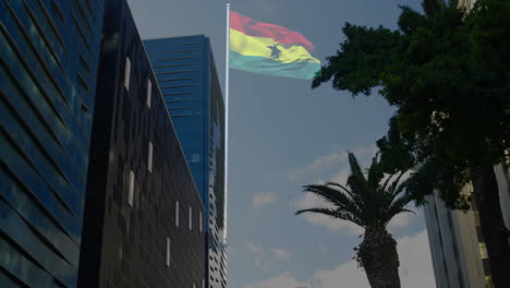 ghanaian flag waving among glass towers and palm tree in business district, using 3d render