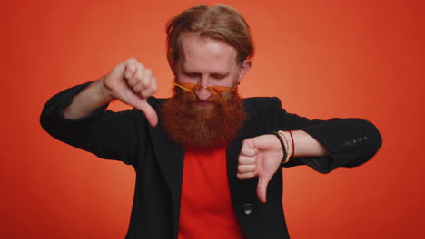 upset man in casual jacket showing thumbs down sign gesture, disapproval, dissatisfied dislike