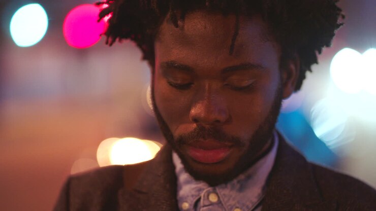 Portrait of an African man looking sad on a night