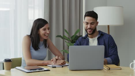 4k video footage of two businesspeople giving each other a high while in a meeting at work