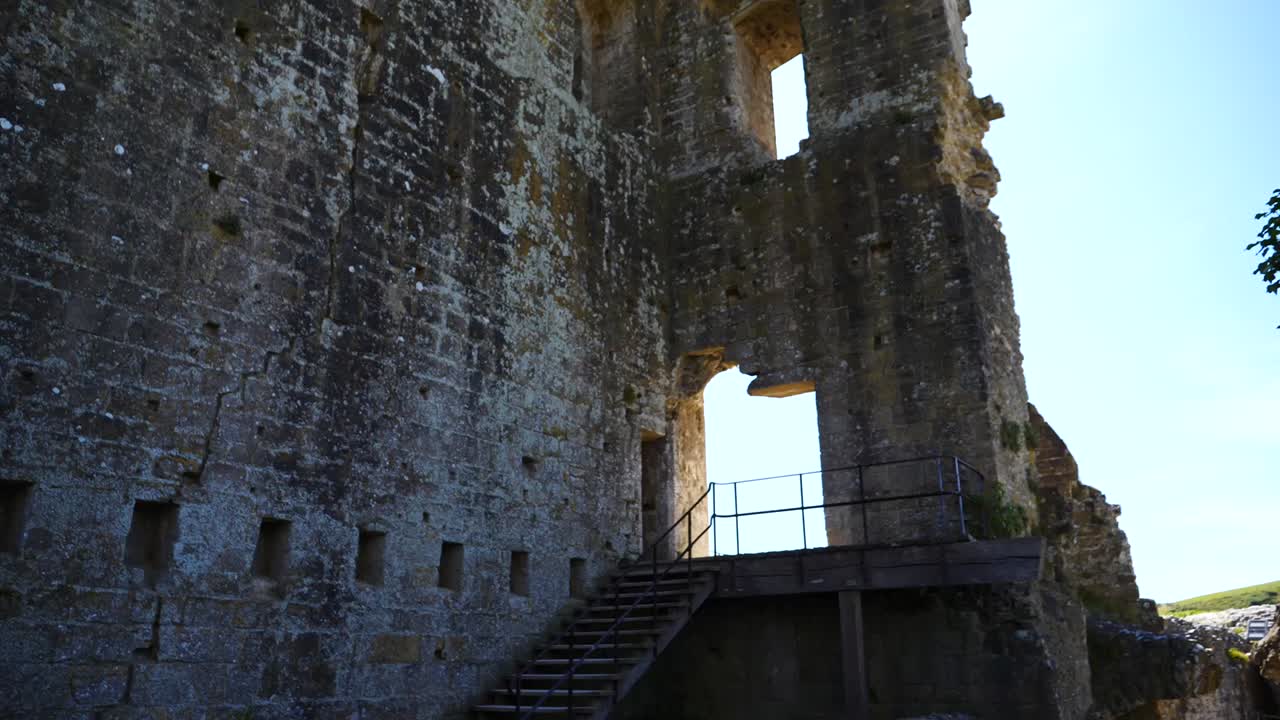 Looking up at old castle ruins into the sky