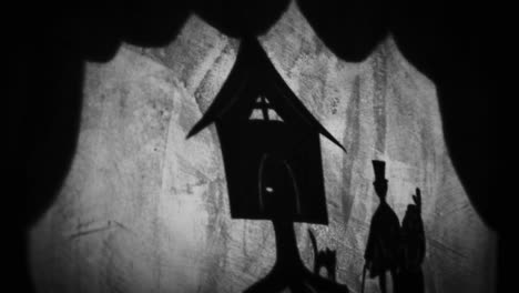 shadow puppet show of a house and man