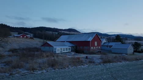 indre fosen, trondelag county, norway - a sight of farmhouses in the month of november - aerial pullback