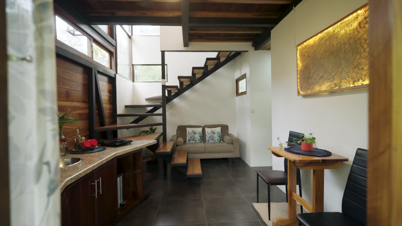 Living Room with Modern Staircase and Kitchen