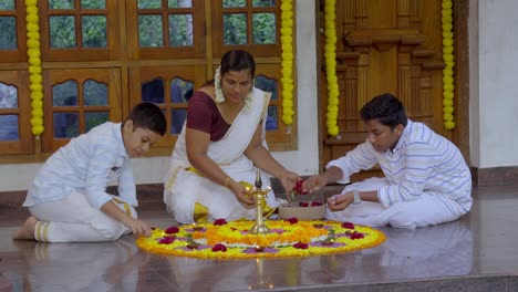 athapookkalam decorating for onam festival in kerala ,pookalam decorating kerala traditional family for onam celebration