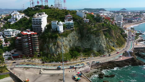 Drone-circling-the-Icebox-hill,-Mirador-Vista-Hermosa,-in-sunny-Mazatlan,-Mexico