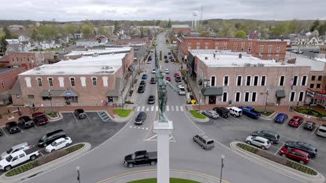 angola, indiana town square roundabout with cars moving around and stable drone video close up