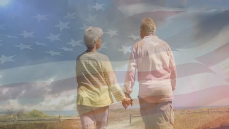 Animation-of-senior-caucasian-couple-holding-hands-on-beach-over-flag-of-united-states-of-america