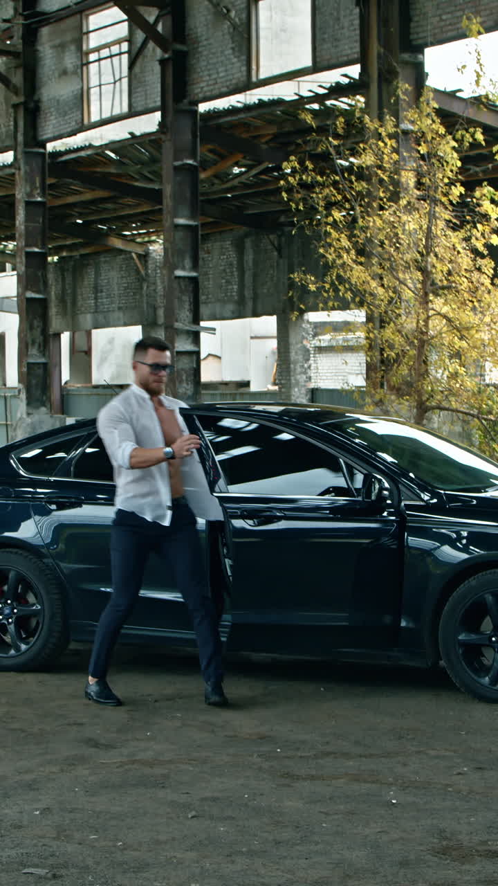 Young brutal man with gun. Brutal man with gun ready to shoot outdoor