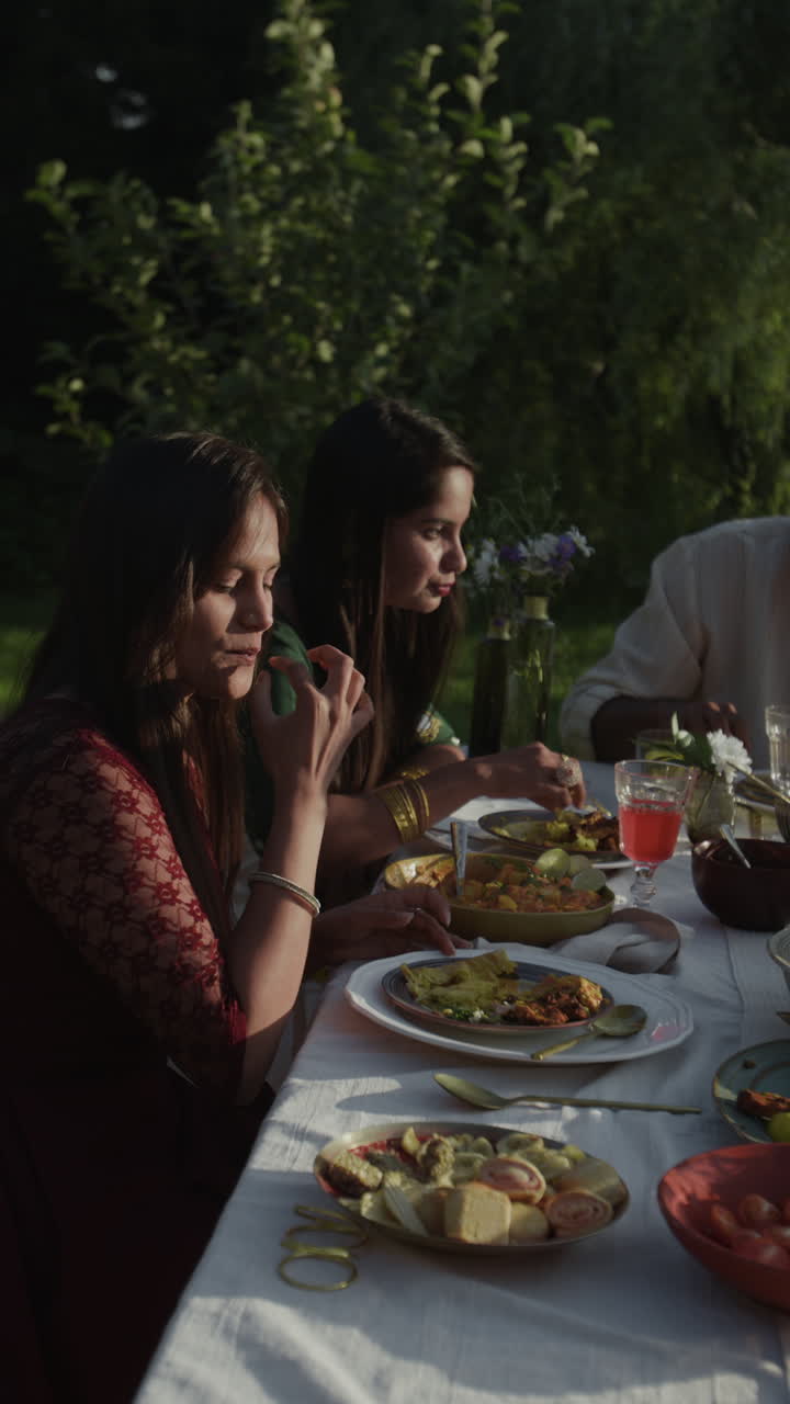 Women Enjoying an Outdoor Meal with Friends