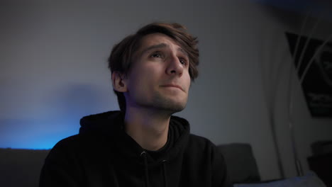 low angle shot of young man playing video games, close-up