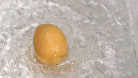 lemon turning in water in super slow motion