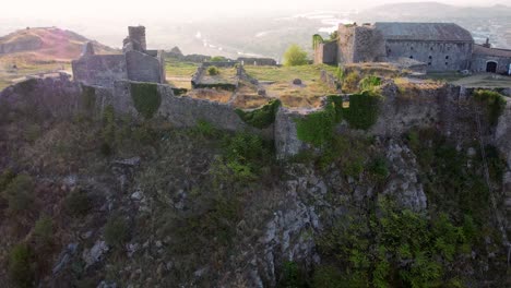 Aerial-zoom-out-of-Rozafa-castle-during-sunrise-in-Shkoder,-Albania