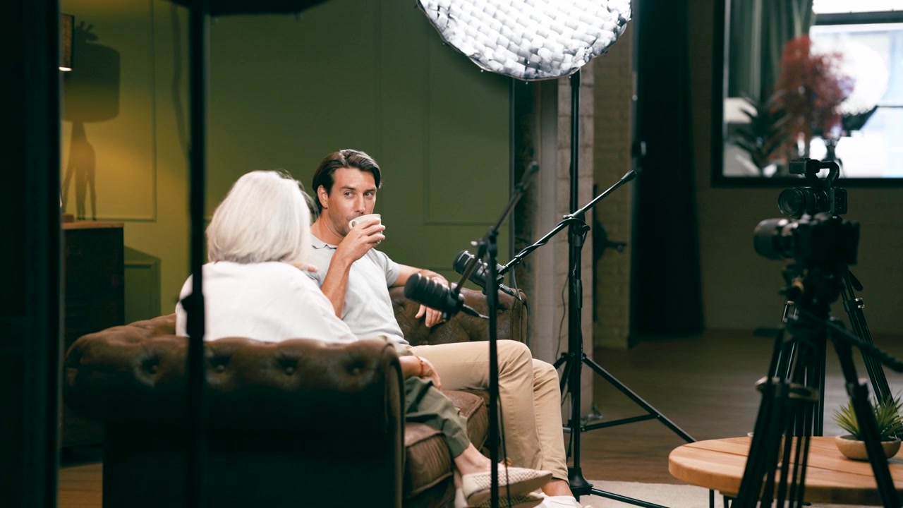 Man and Woman Having a Conversation in a Professional Studio Setting