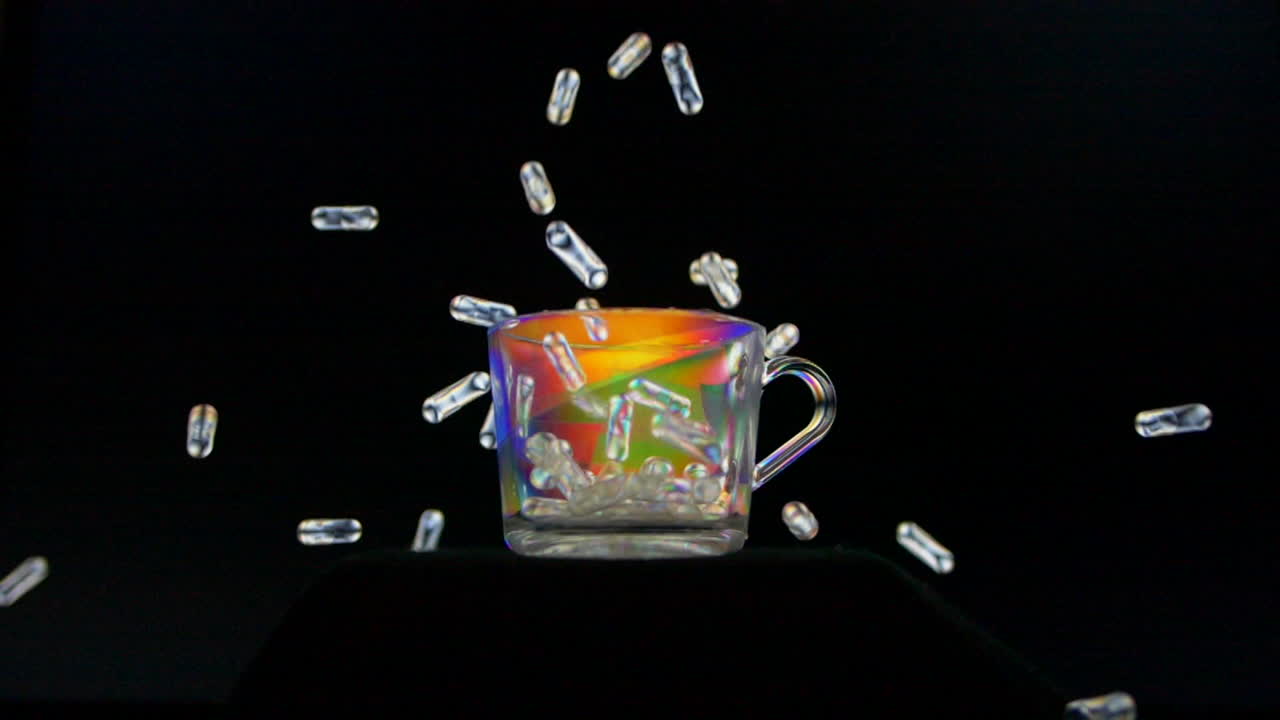 píldoras que caen en una taza colorida contra un fondo oscuro