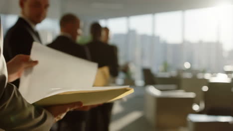 Business professionals reviewing documents in a modern office