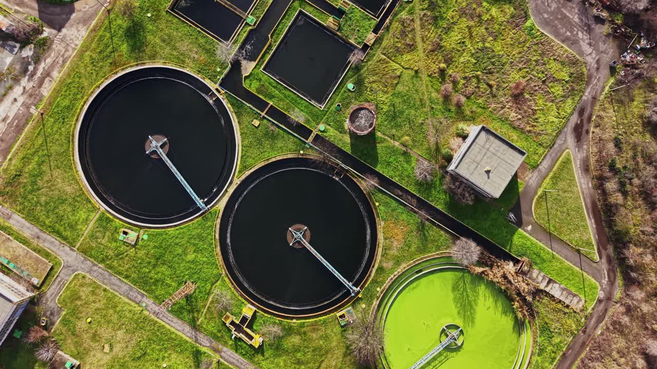 Water treatment facility with large circular tanks seen from above